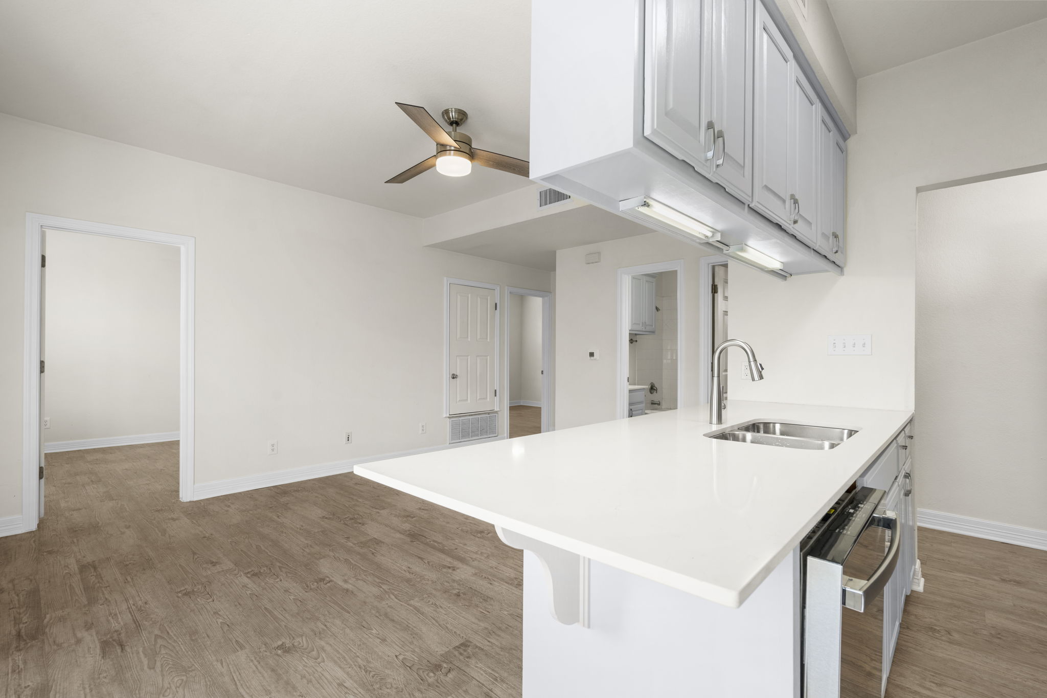 Kitchen peninsula with hex tile backsplash — fully renovated 2024, Whitestone West Campus UT Austin